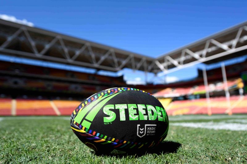Photo of a football on the middle of the field at Suncorp Stadium.
